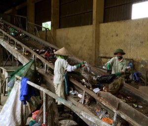 Sorting waste at Hanoi landfill